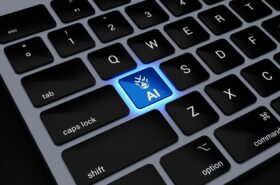 a computer keyboard with a blue light on it